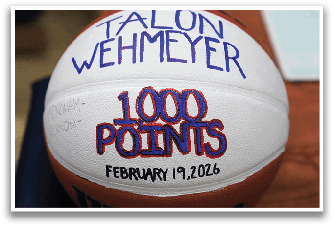 A basketball with the name Talon Wehmeyer written on it. AI generated content