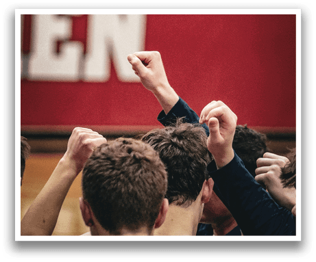 A group of men are huddled together, with their arms around each other, in front of a red and white banner. AI generated content