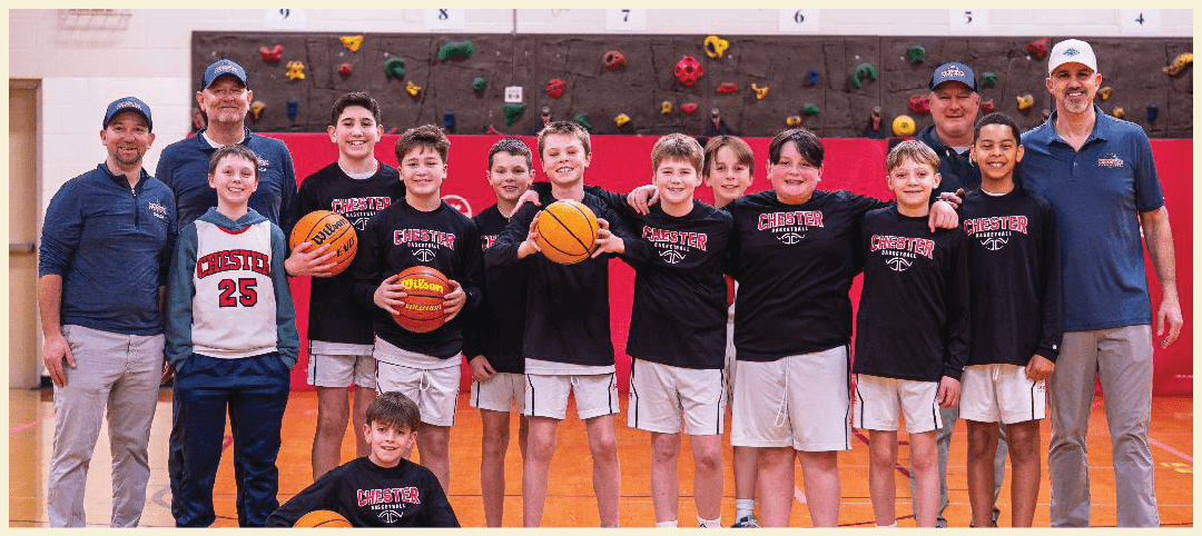 A group of young boys posing for a picture on a basketball court. AI generated content