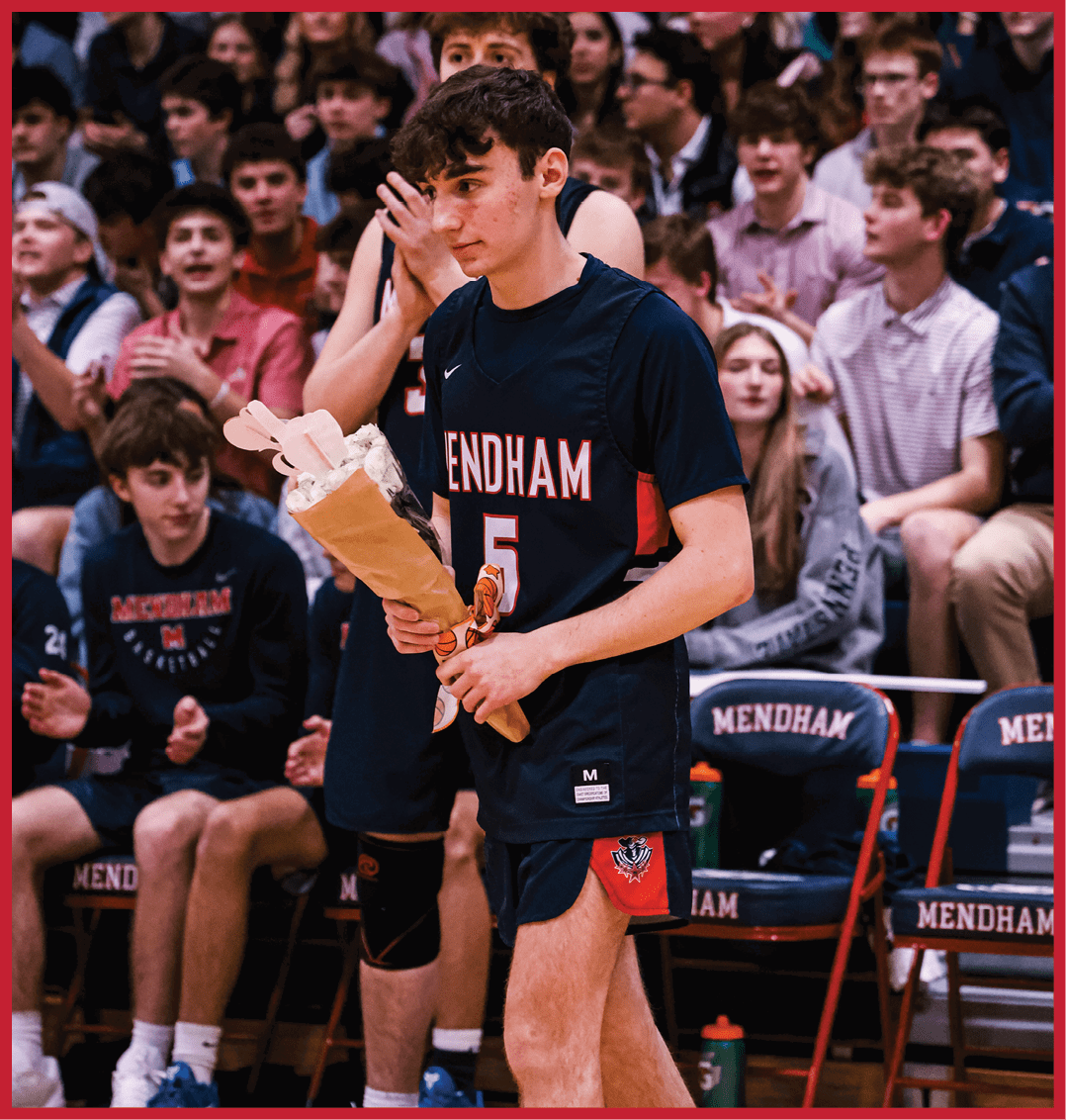 A man holding a bouquet of flowers walks on a basketball court. AI generated content