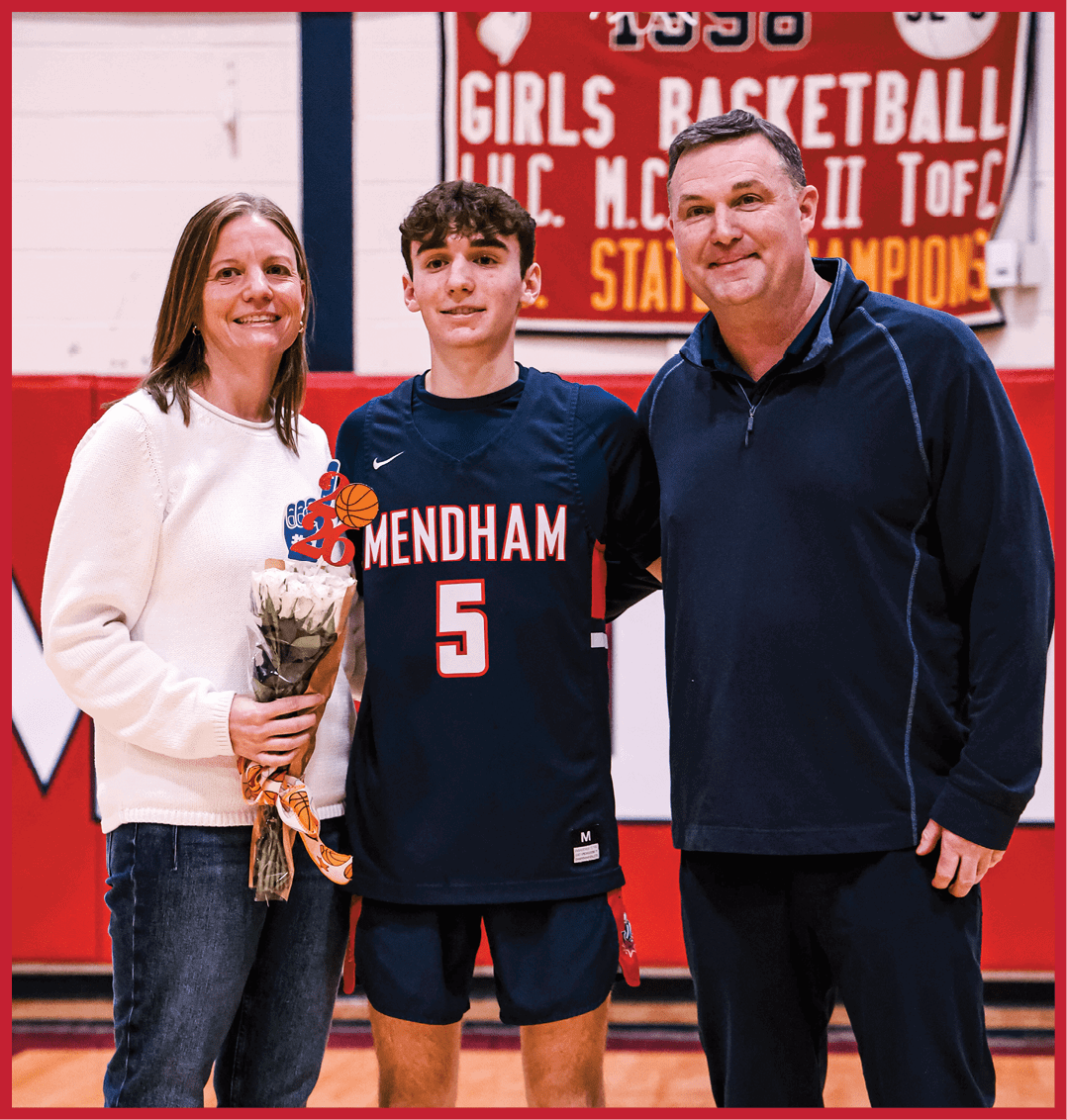 A man and woman pose with a basketball player in front of a banner. AI generated content