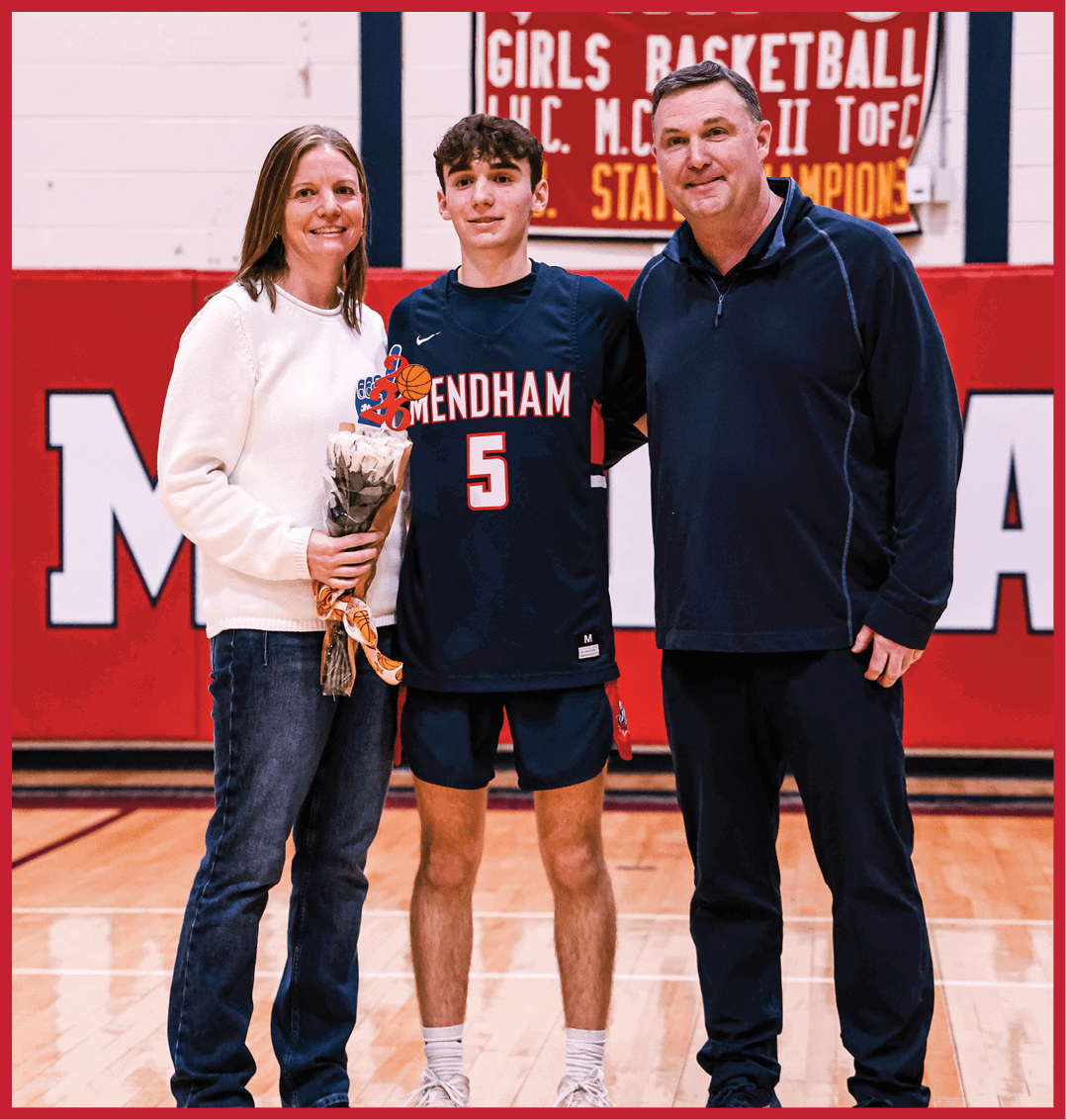 A man, woman, and boy pose for a photo on a basketball court. AI generated content