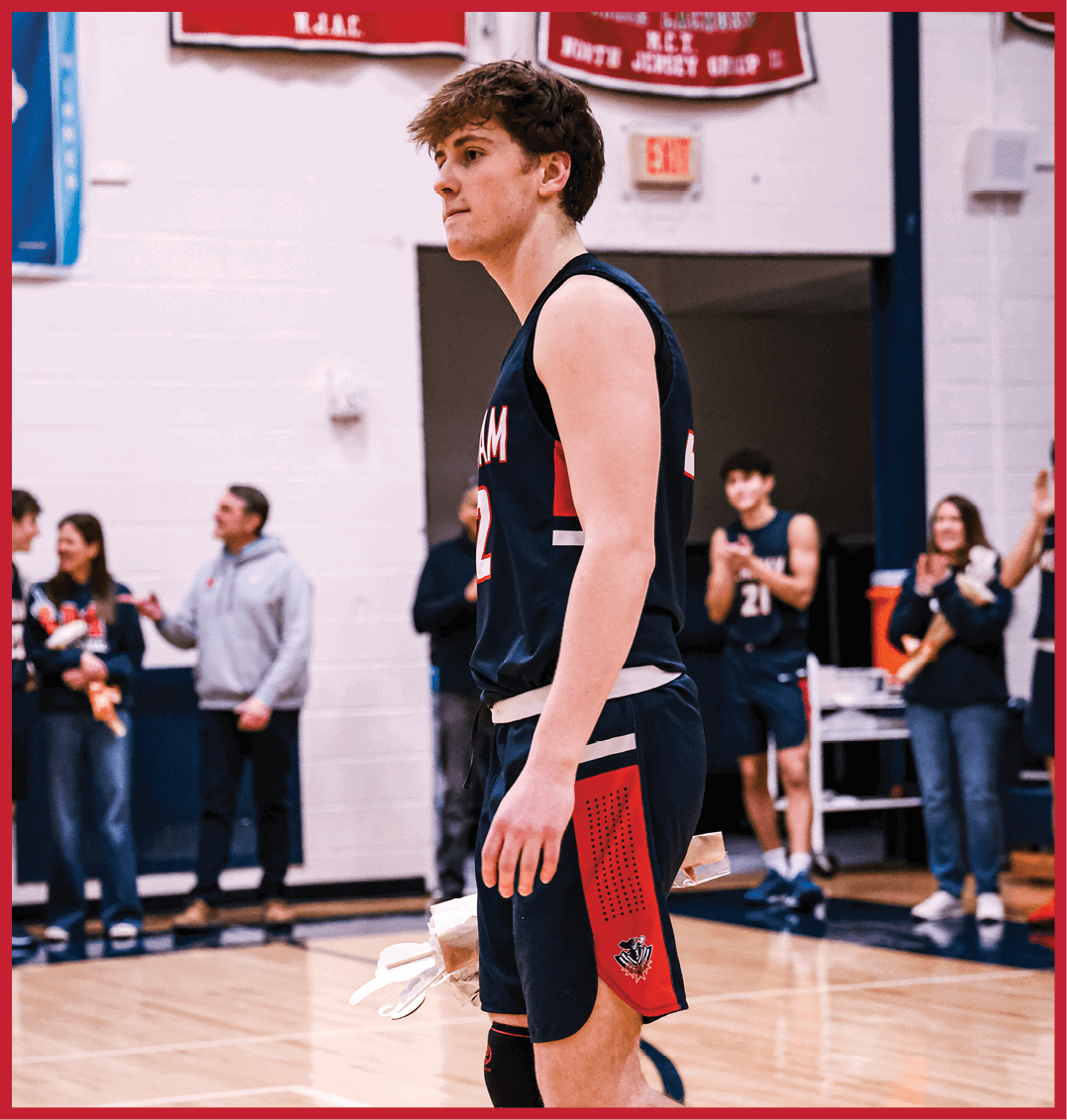 A basketball player wearing a blue uniform walks on the court. AI generated content