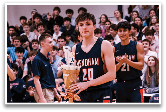 A boy holds a bouquet of flowers while walking on a basketball court. AI generated content