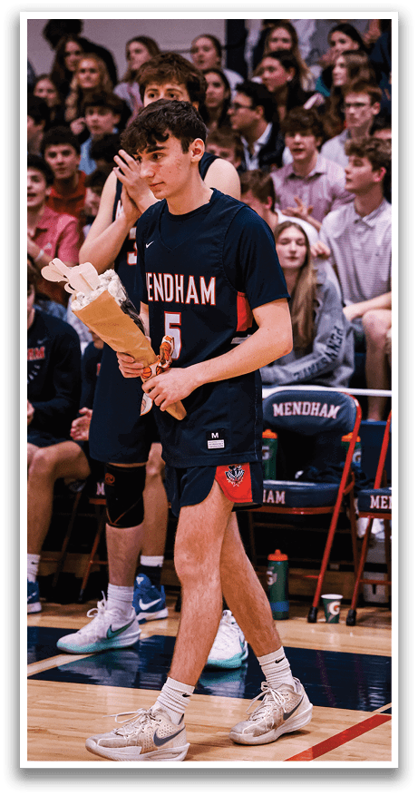 A man holding a bouquet of flowers walks on a basketball court. AI generated content