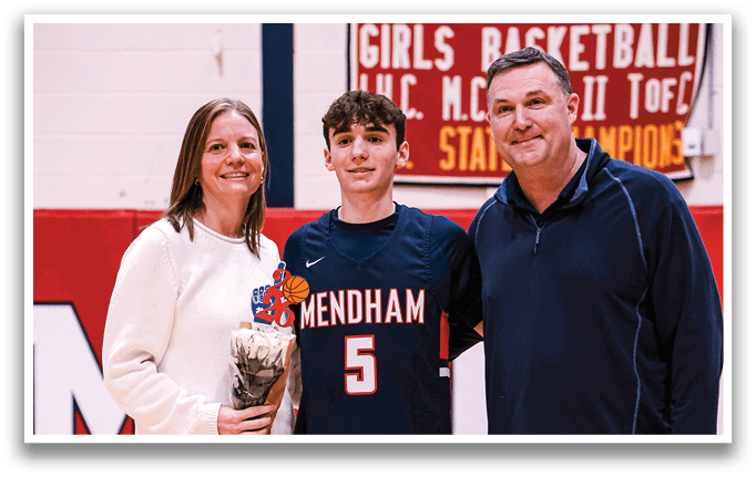 A man and woman pose with a basketball player in front of a banner. AI generated content