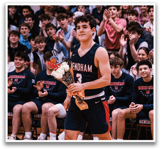A male athlete holds a bouquet of flowers while walking on a basketball court. AI generated content