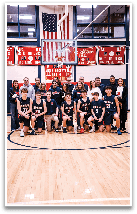 A group of young men and women pose for a photo on a basketball court. AI generated content