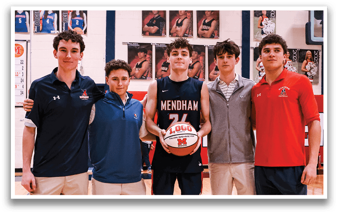 A group of young men pose for a picture on a basketball court. AI generated content
