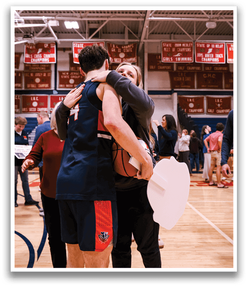 Two people hugging on a basketball court. AI generated content