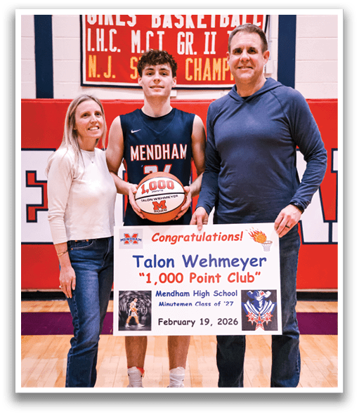 A man and woman pose with a basketball player in front of a banner. AI generated content