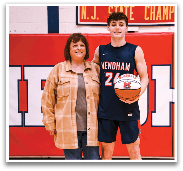 A man and woman are standing on a basketball court, the man holding a basketball. AI generated content
