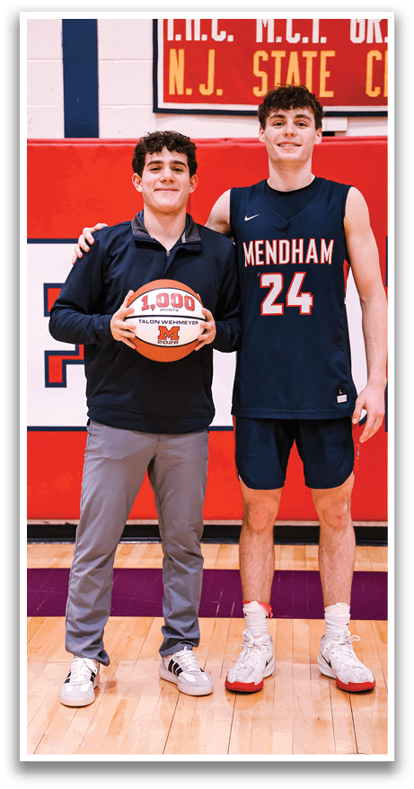 Two young men are standing next to each other, one holding a basketball. AI generated content