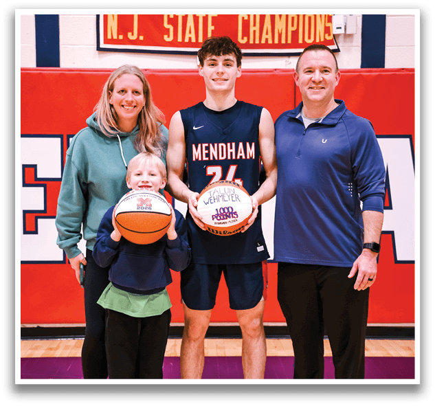 A man and two children pose with basketballs in front of a sign. AI generated content