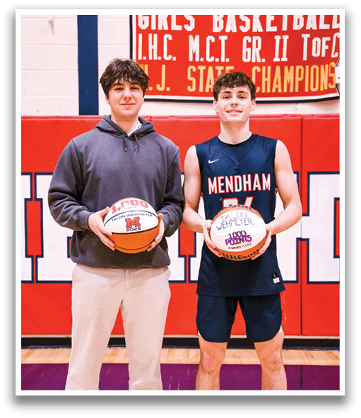Two young men are standing on a basketball court, holding basketballs. AI generated content