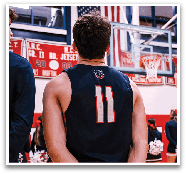 A basketball player wearing a jersey with the number 11 stands on the court. AI generated content