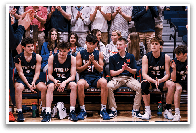 A group of young men are sitting on a bench, clapping for their teammates. AI generated content