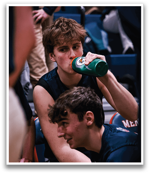 Two boys sitting on the floor, one drinking from a green bottle. AI generated content