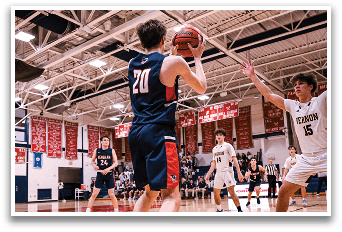 Basketball players on a court, one holding a ball, another reaching for it. AI generated content