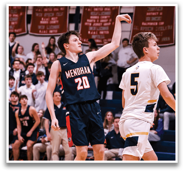 A basketball game is taking place with a player in the foreground reaching for the ball. The player is wearing a black jersey and is surrounded by other players. The scene is filled with excitement as the players compete for the ball. AI generated content