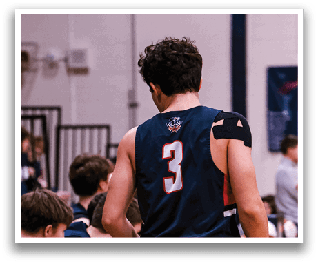 A man wearing a basketball uniform walks down a hallway. AI generated content