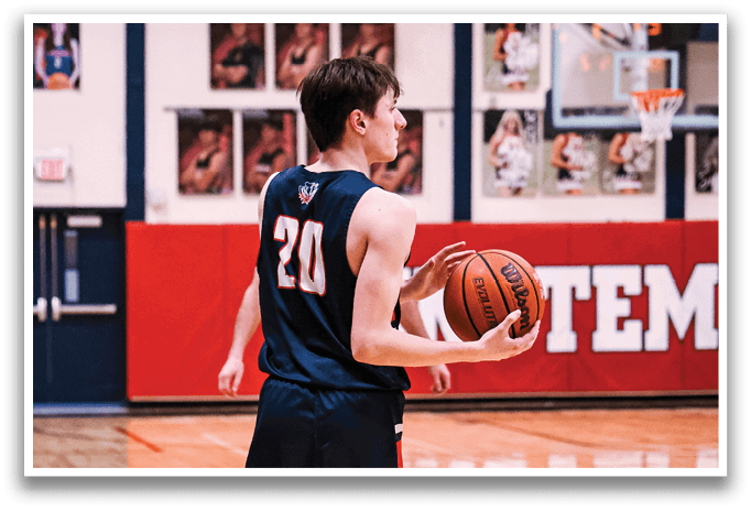 A person in a basketball uniform holding a basketball on a court. AI generated content