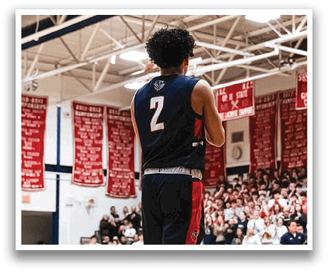 A basketball player wearing a blue jersey with the number 2 on it stands on the court. AI generated content