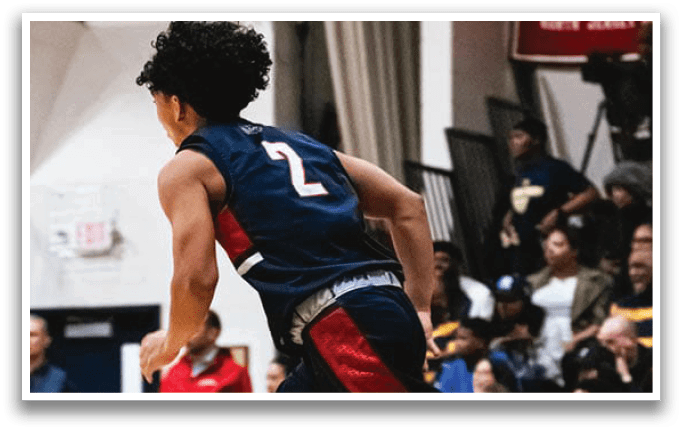 A basketball player wearing a blue uniform with the number 2 on the back is running down the court. AI generated content