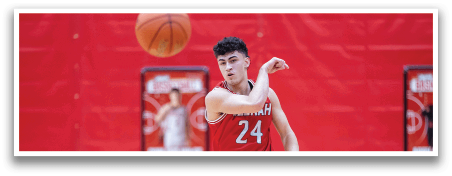 A man in a red basketball uniform is playing basketball. AI generated content