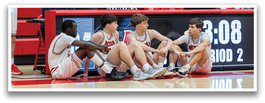 A man in a red basketball uniform is playing basketball. AI generated content