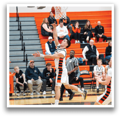 A basketball player leaps in the air to catch a rebound. AI generated content