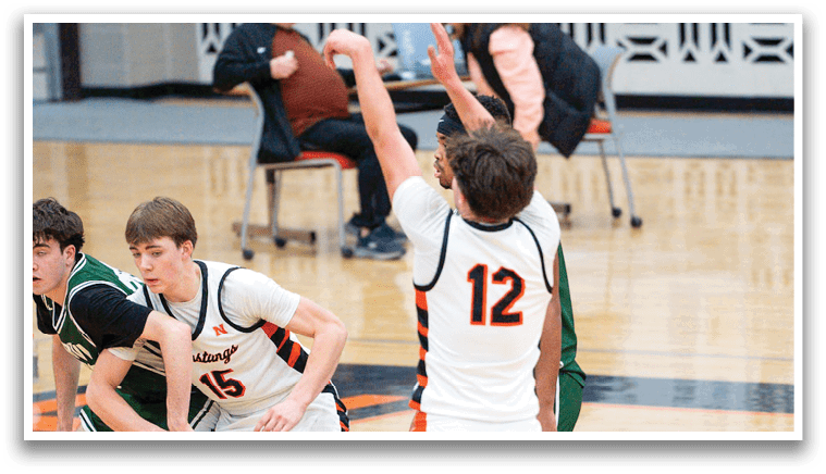 A group of young men playing basketball on a court. AI generated content
