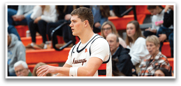 A man in a white uniform stands on a basketball court, holding a ball. AI generated content