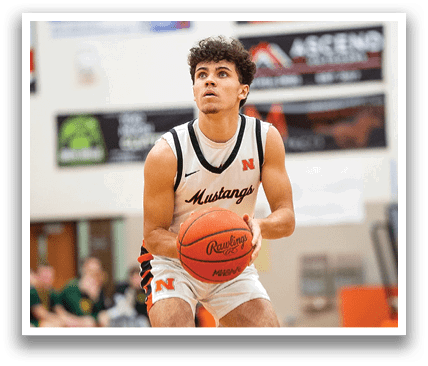 A man in a basketball uniform is holding a basketball on a court. Contenido generado con IA
