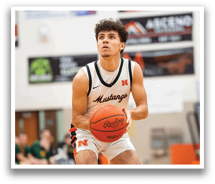 A man in a basketball uniform is holding a basketball on a court. Contenido generado con IA