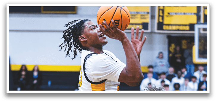 A group of men playing basketball, one player is jumping in the air to grab the ball. Contenido generado con IA