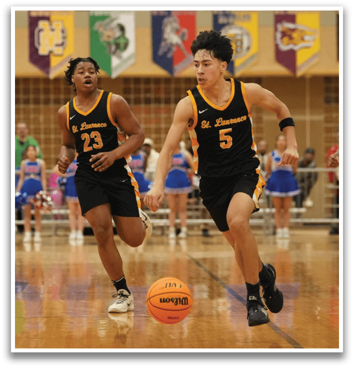 A group of basketball players are running on a court, with one player holding a basketball. The players are wearing uniforms and are actively engaged in the game. Contenido generado con IA