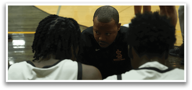 A group of basketball players on the court, one of them is talking to a coach. AI generated content