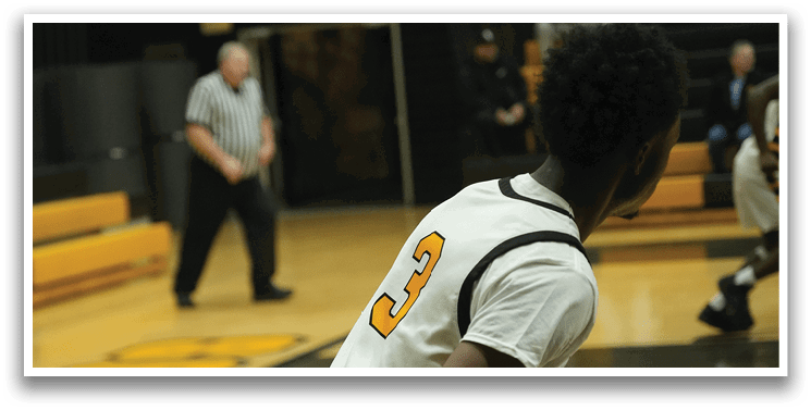 A basketball player wearing a white jersey with the number 3 on it is running down the court. AI generated content