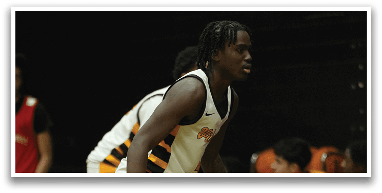 A basketball player is bent over, holding his knee, while sitting on the bench. AI generated content