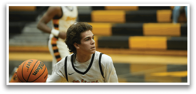 A basketball player wearing a black and yellow jersey holds a basketball. AI generated content