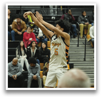 A basketball player is in the air, attempting to shoot the ball. The crowd is watching intently as the player jumps. AI generated content