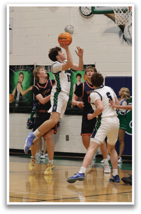 Two basketball players are competing for a rebound, with one player jumping in the air to grab the ball. AI generated content