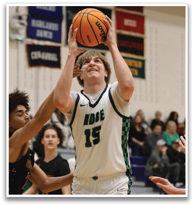 A basketball player in a white uniform is attempting to block a shot. AI generated content