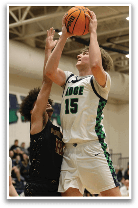 Two basketball players are competing for a rebound, with one player jumping in the air to grab the ball. AI generated content