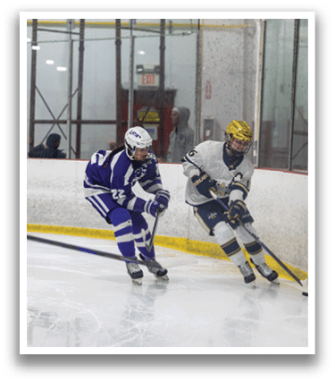 Two hockey players are on the ice, one wearing a blue and white uniform and the other wearing a white and blue uniform. They are both holding hockey sticks and are in the middle of a game. AI generated content