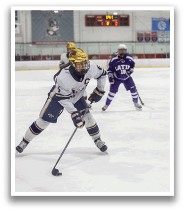 A female hockey player with the number 6 on her jersey is skating on the ice. AI generated content