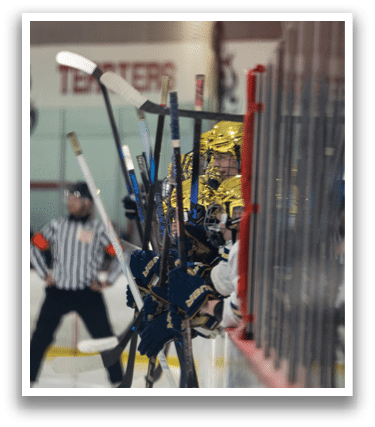 A hockey player is holding his stick up in the air. AI generated content