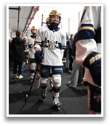 A hockey player wearing a white and blue uniform is walking down a hallway. AI generated content