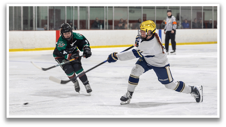 A female hockey player is about to shoot the puck, while another player tries to block her. AI generated content